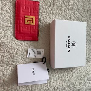 Balmain card wallet with zipper . Color is more Coral than pink. No damage.